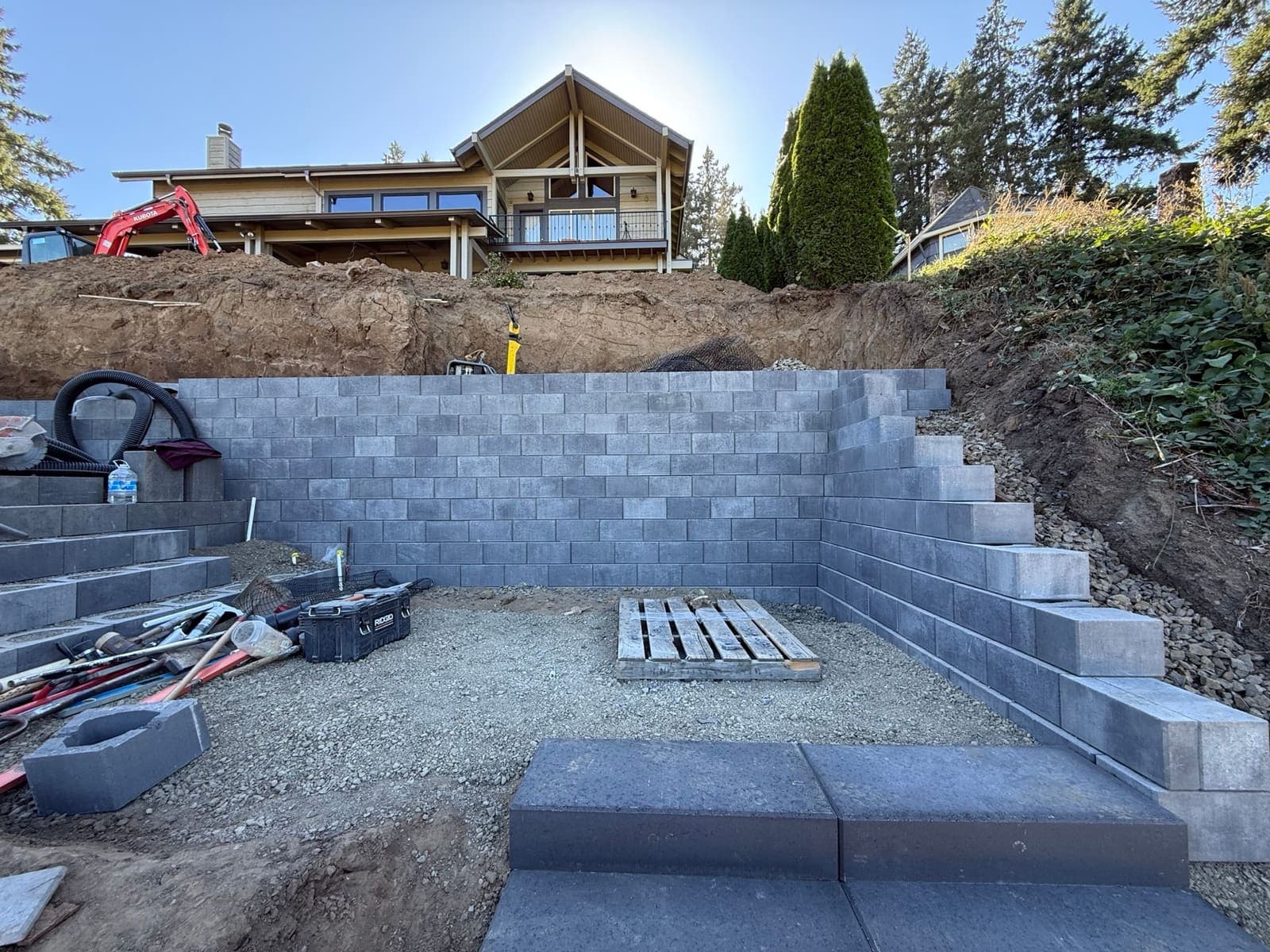 Retaining wall with integrated stairway leading down to the Willamette River in West Linn, Oregon