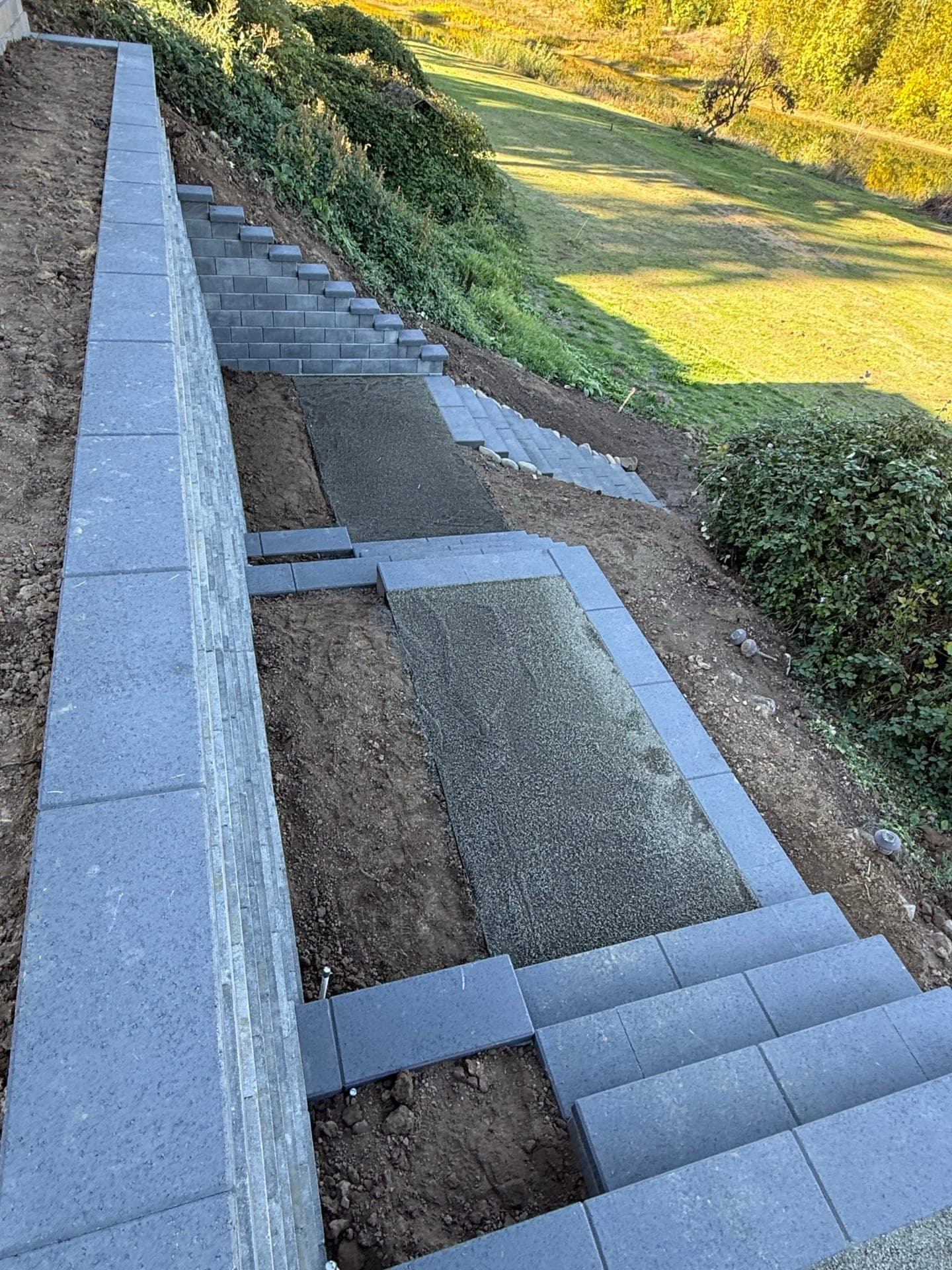Finished residential retaining wall and river access stairway in West Linn, Oregon