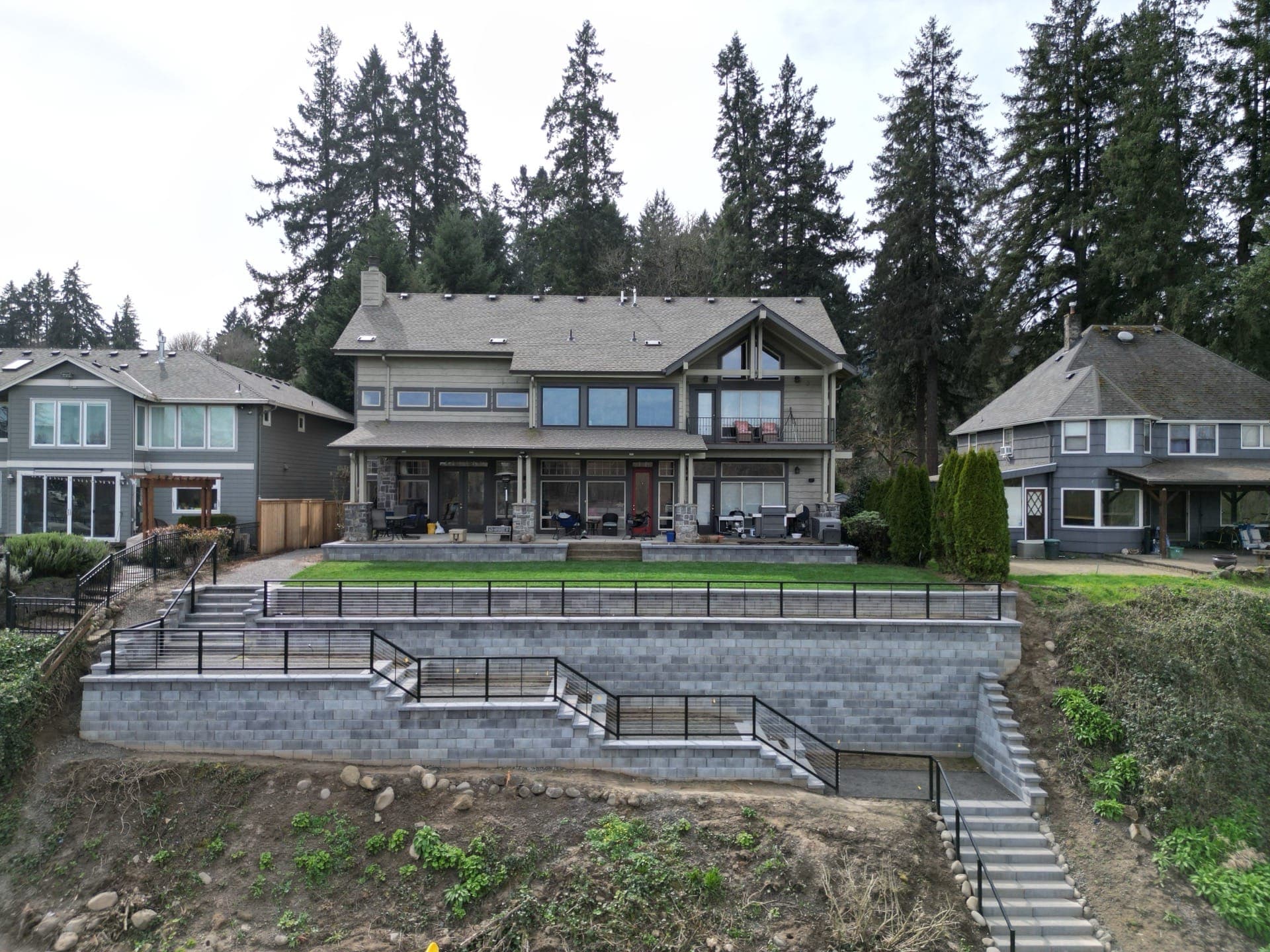 Large engineered residential retaining wall on a riverfront property