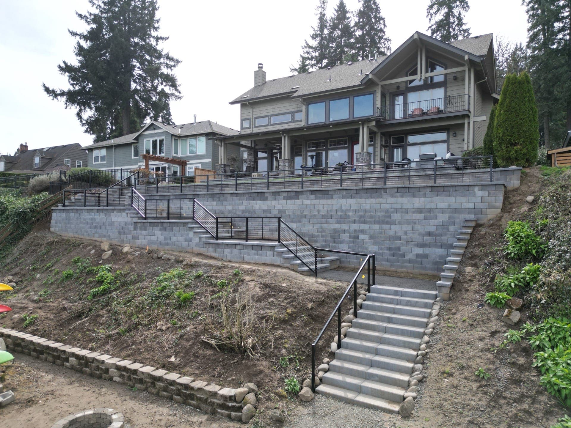 Aerial view of the completed riverfront retaining wall and stairway in West Linn, Oregon
